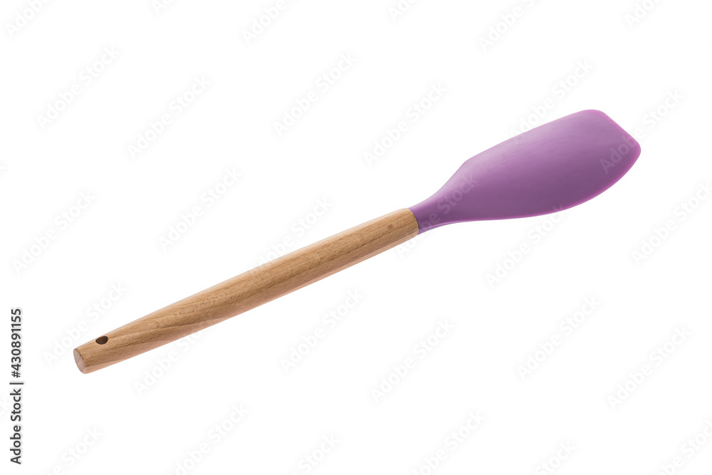 Kitchen tool for preparing food. Wooden handle. Lilac. Flat spatula for turning food in the pan. White isolated background. Kitchen tool for preparing food. Wooden handle. Lilac. Flat spatula for turning food in the pan. White isolated background.