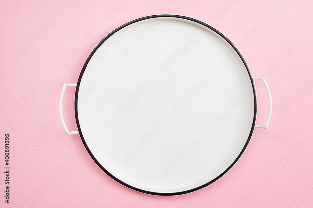 Empty white tray plate isolated on pink background Empty white tray plate isolated on pink background