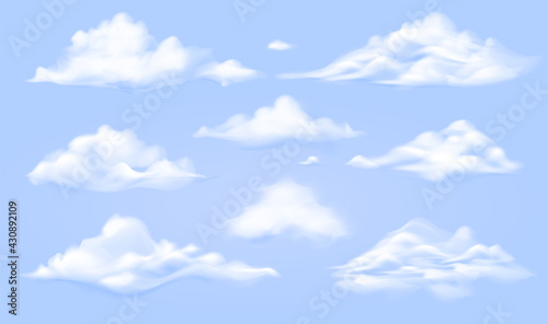 White clouds isolated on blue background. Realistic cloudscape forms for sky weather design. Vector fluffy cloud set. Heaven illustration EPS10