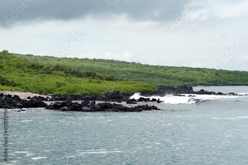 Waves breaking on a rugged coastline at Urbina Bay, Isablea Island, Galapagos, Ecuador photo