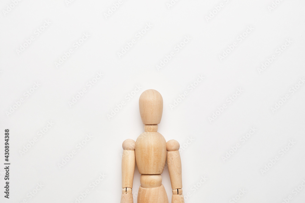 Bust of a wooden doll on a white background with copy space Bust of a wooden doll on a white background with copy space