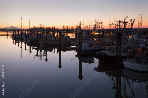 Steveston Harbour Calm Twilight. Twilight dawn view of Steveston Harbour and Mount Baker on the Fraser River. British Columbia, Canada.