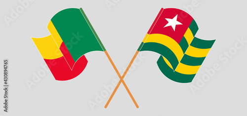 Crossed and waving flags of Benin and Togo