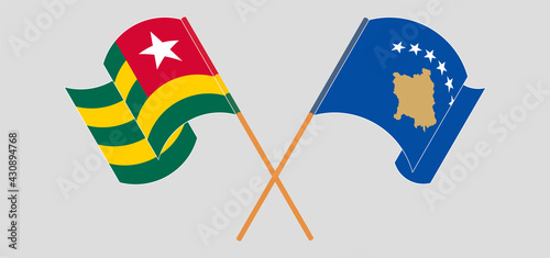 Crossed and waving flags of Togo and Kosovo