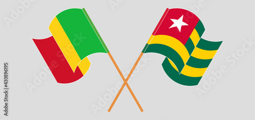 Crossed and waving flags of Mali and Togo
