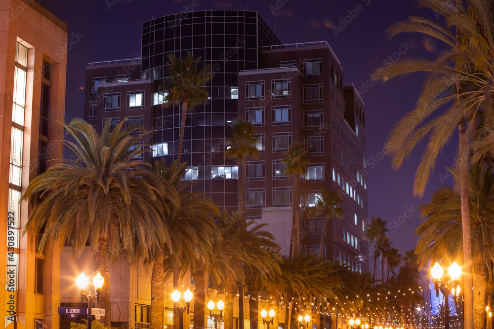 Night descends on the skyline of the Anaheim, California USA. - obrazy, fototapety, plakaty 