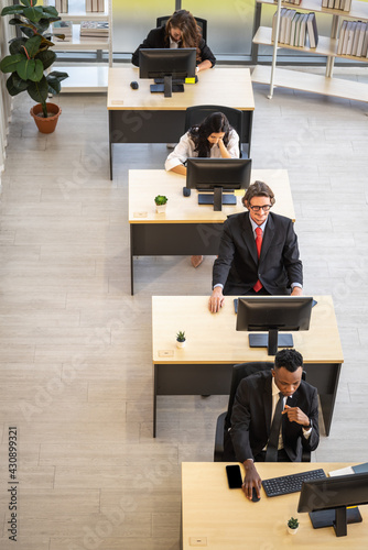 Diversity Business and Work palce concept. Group of businessman and busineewoman team colleague woking in office with desktop computer. photo