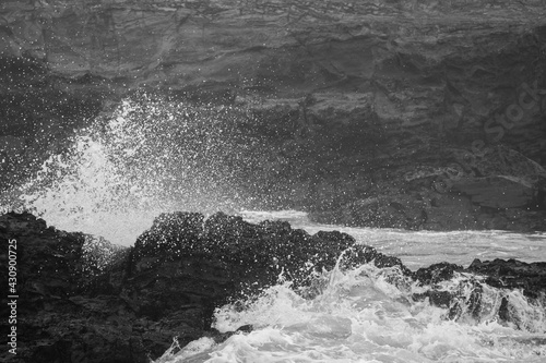 waves crushing on rocks © juan