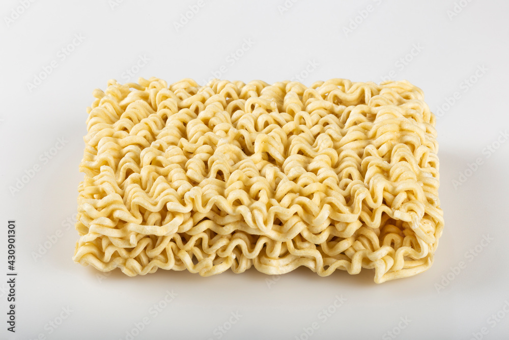 Raw instant noodles on white background. Raw instant noodles on white background.