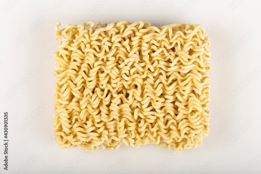 Raw instant noodles on white background. Raw instant noodles on white background.
