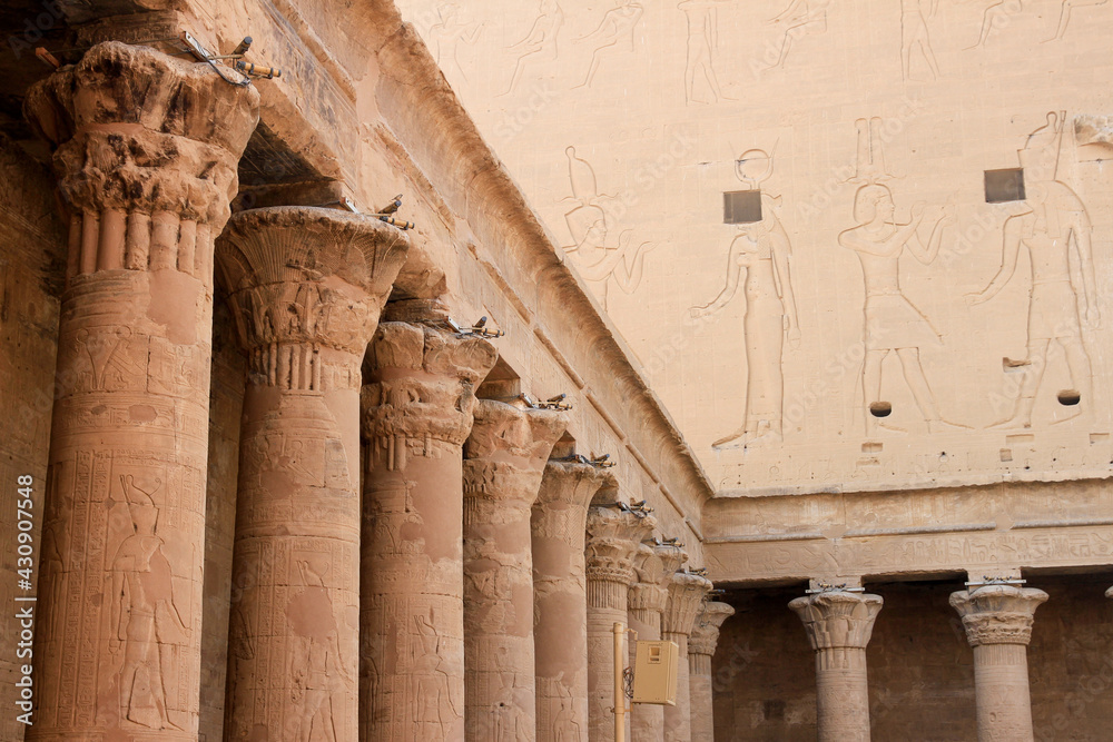 Row of columns with hieroglyphics in courtyard of Temple of Edfu, Edfu, Egypt Row of columns with hieroglyphics in courtyard of Temple of Edfu, Edfu, Egypt