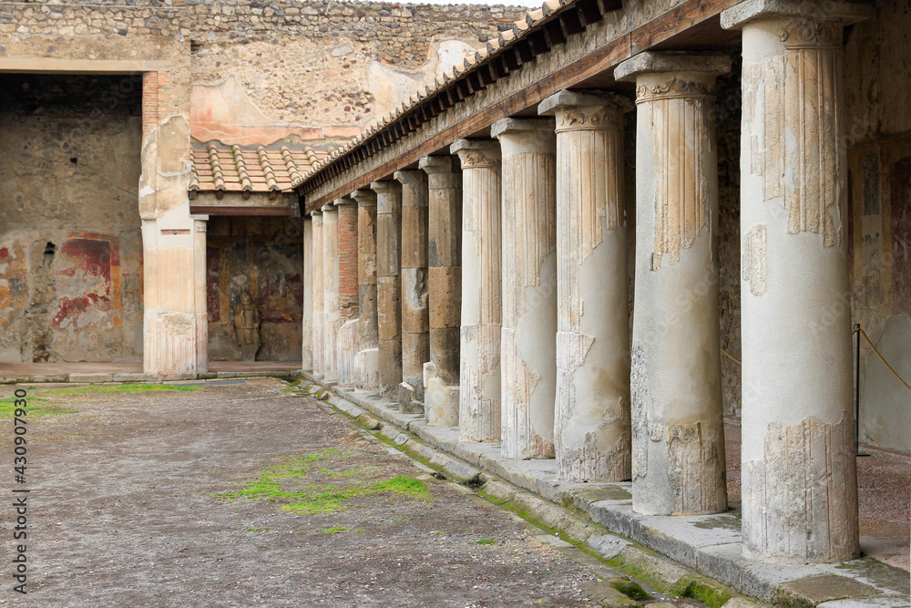 Columns in courtyard in Roman villa in Pompeii, Italy