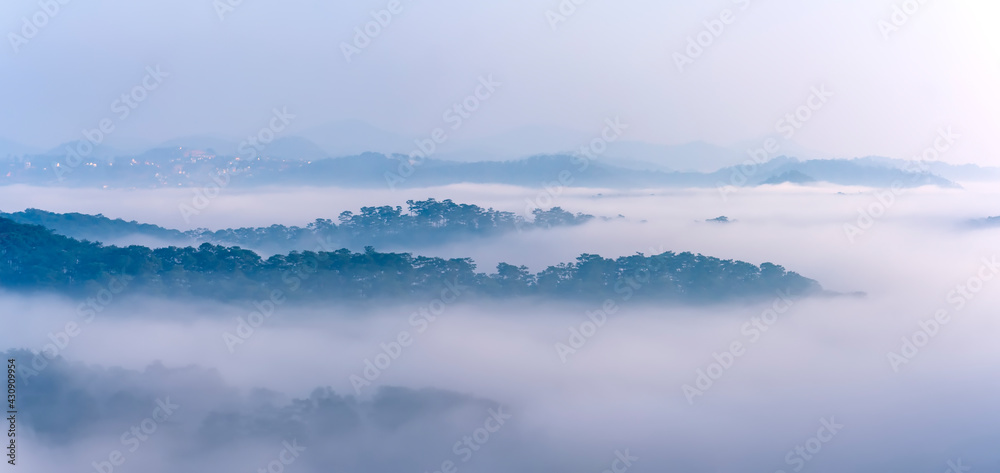 The morning scenery on the hillside in the misty highlands below the beautiful valley The morning scenery on the hillside in the misty highlands below the beautiful valley