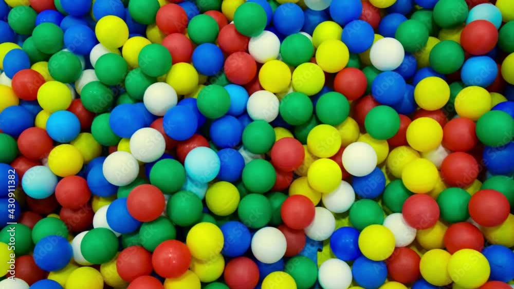 colored plastic balls in a children's playroom. background. texture. colored plastic balls in a children's playroom. background. texture.