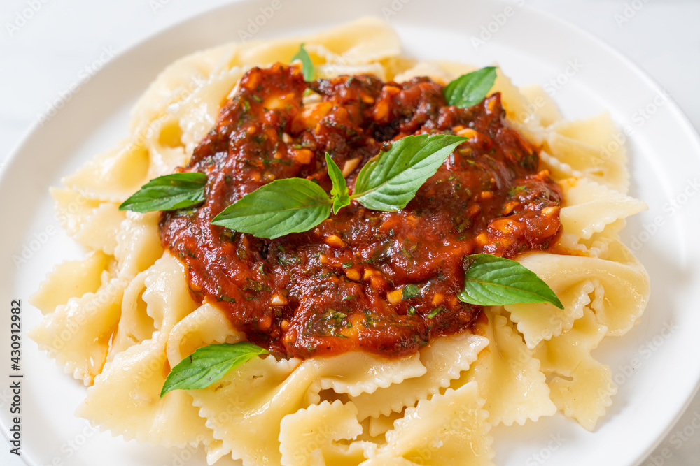 farfalle pasta with basil and garlic in tomato sauce farfalle pasta with basil and garlic in tomato sauce