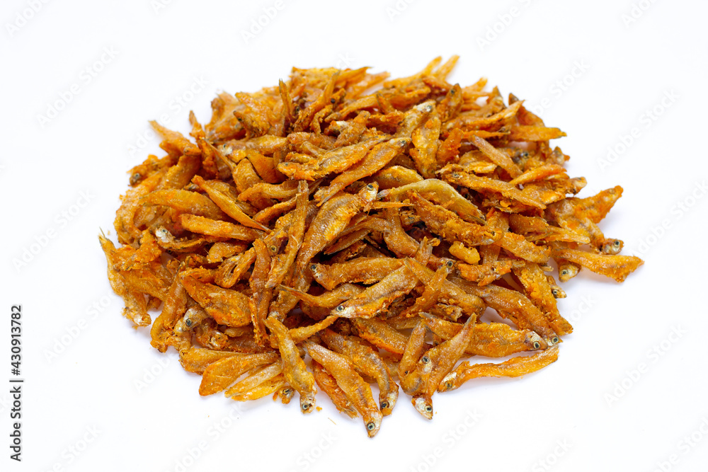 Fried anchovies on white background.