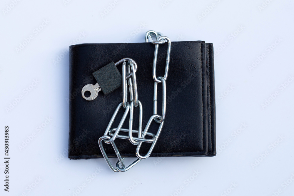 Black wallet in chains closed padlock on white background. Black wallet in chains closed padlock on white background.
