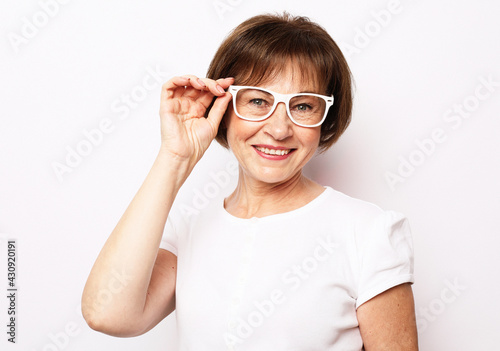 Lifestyle and old people concept  Smiling senior woman wearing glasses and smiling