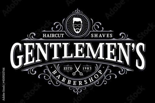 Barbershop vintage lettering logo with decorative ornamental frame photo
