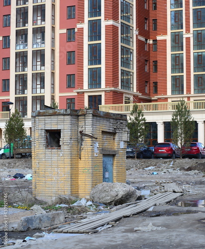 Old transformer box in the yard of a residential building under construction, 6 Dybenko street, St. Petersburg, Russia, April 2021 photo