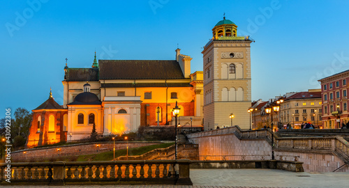 Evening view of St. Anna academic church, kosciol Sw. Anny, at Krakowskie Przedmiescie street in Starowka Old Town historic disrict of Warsaw, Poland photo