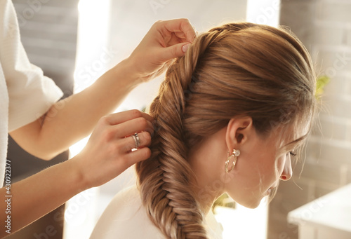 Hairdresser working with cl...