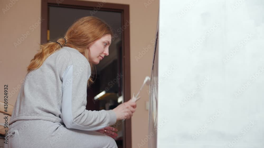 Woman painting furniture cabinet restoration old cupboard Woman painting furniture cabinet restoration old cupboard