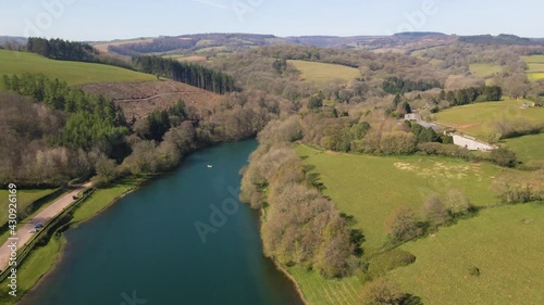 4K flying over hawkridge reservoir, drone moving forward over the water and over a trout fishing boat, 60fps. photo