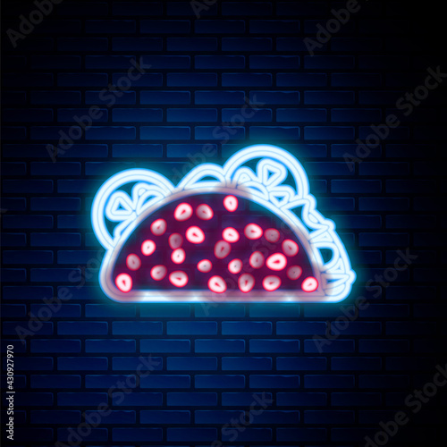 Glowing neon line Taco with tortilla icon isolated on brick wall background. Traditional mexican fast food. Colorful outline concept. Vector