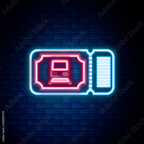 Glowing neon line Train ticket icon isolated on brick wall background. Travel by railway. Colorful outline concept. Vector
