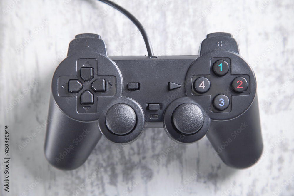 Game controller on white desk. Game controller on white desk.