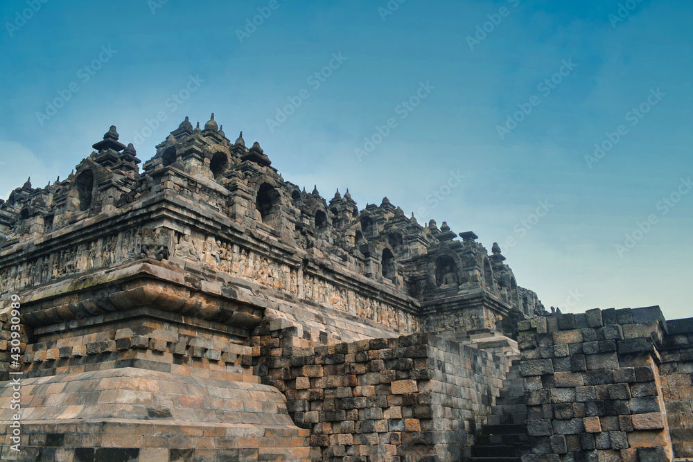 Architectural design of Borobudur temple in Indonesia. Monumental ancient architecture, carved stone walls