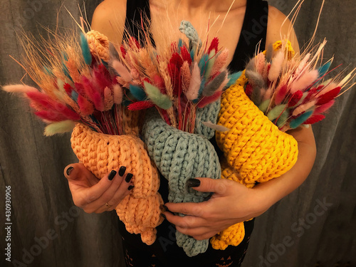 person holding a bunch of flowers