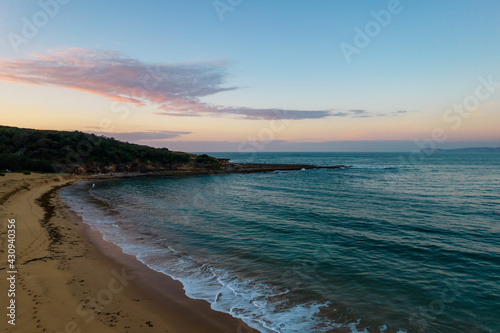 Aerial sunrise seascape with headland and national park