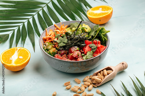 Organic hawaiian tuna poke bowl with rice and vegetables