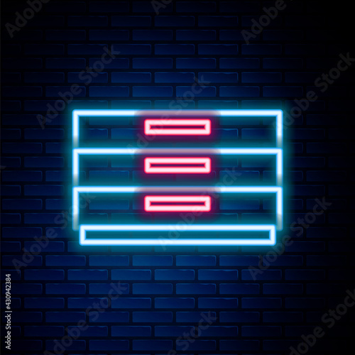 Glowing neon line Chest of drawers icon isolated on brick wall background. Colorful outline concept. Vector