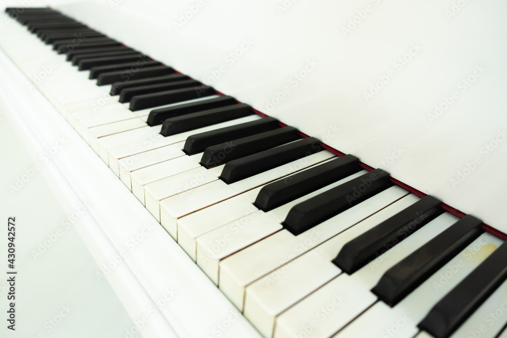white grand piano with keys close-up. classical music white grand piano with keys close-up. classical music