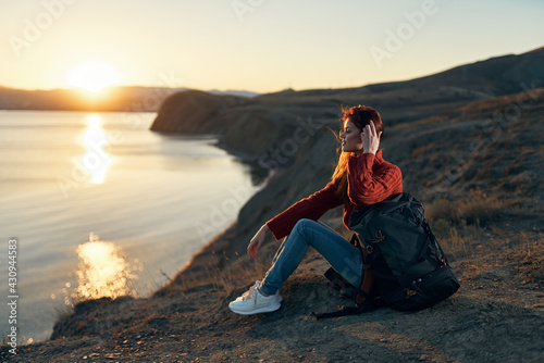 woman hiker backpack rocky mountains travel fresh air sun