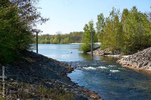 river flows into a dredging lake