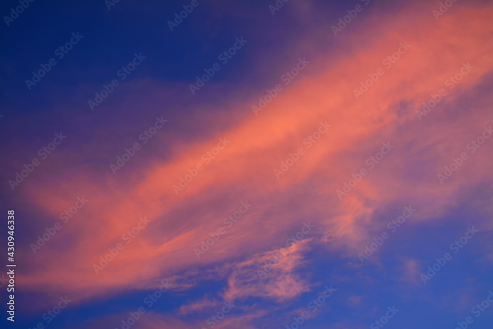Amazing view of sunrise sky with red clouds. Nature background. Dramatic clouds on the sky in red colors