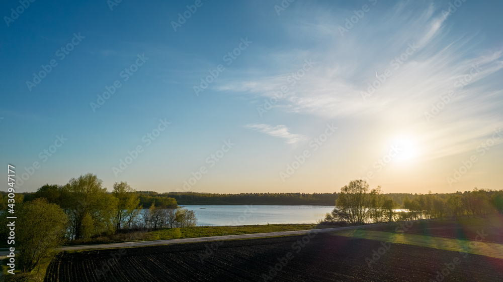 Stunning aerial drone landscape image of sunset or sunrise in spring over Europese countryside. High quality photo Stunning aerial drone landscape image of sunset or sunrise in spring over Europese countryside. High quality photo