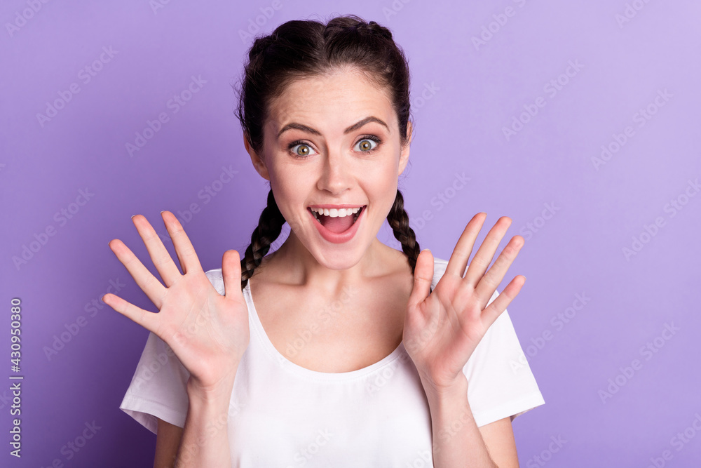 Portrait of impressed positive lady arms palms up open mouth cant believe isolated on purple color background