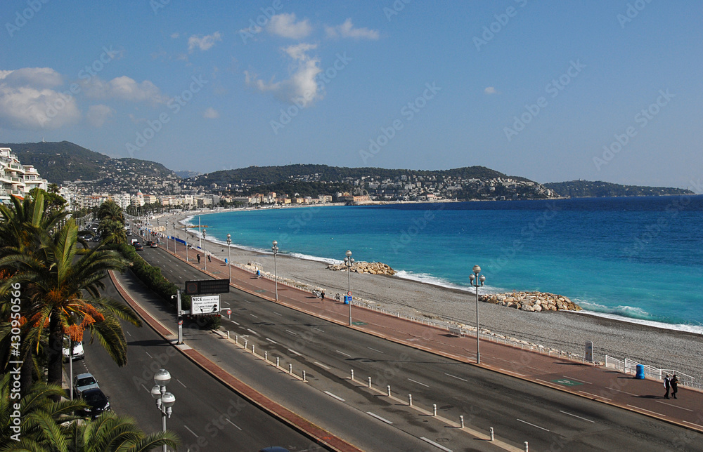 Naklejka premium View of Nice Des Anglaise with Cap Ferrat in the background and the beautiful azur blue Mediterranean.