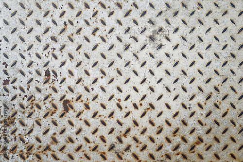 Pattern of old metal diamond plate, Surface of steel floor non-skid, White painted with rusted and dirty stain, Texture background