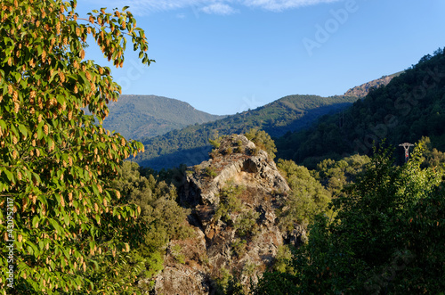 Rocks and Electricity pylon in the Golo valley. Corsica island photo