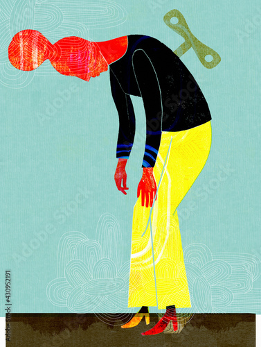 Worn out woman with clockwork key photo