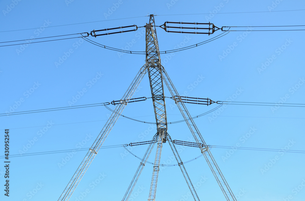 New electric pole in Lower Silesia, Poland. Modern and big pole providing electricity for different towns and villages in the area. New electric pole in Lower Silesia, Poland. Modern and big pole providing electricity for different towns and villages in the area.