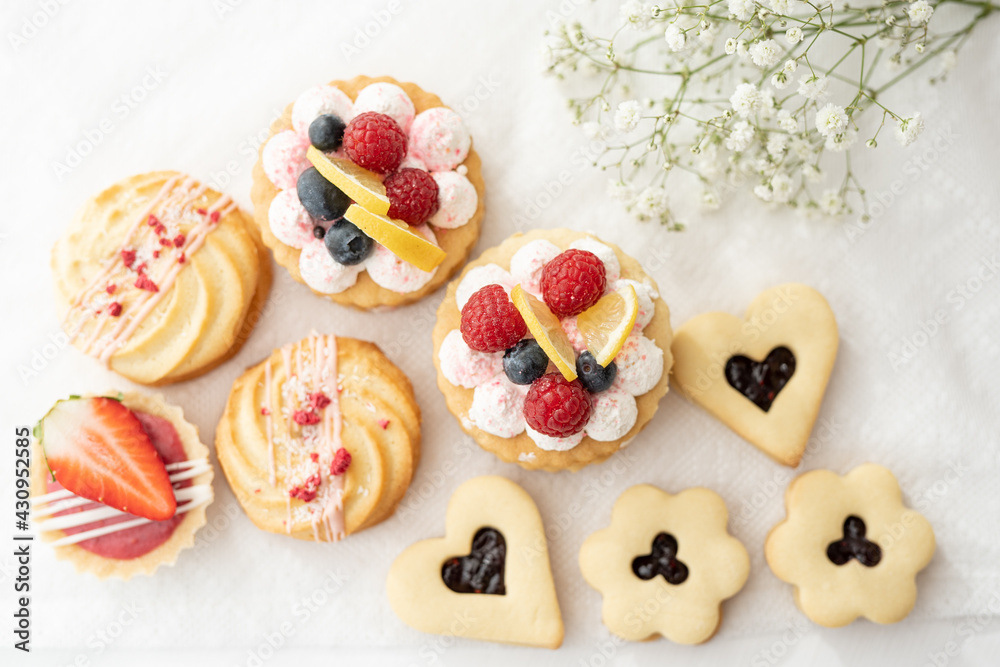 selection of sweet baked cream edible flowers and fruit dessert cakes for mothersday, wedding, birthday, paerty celebration. viola odorata cake. selection of sweet baked cream edible flowers and fruit dessert cakes for mothersday, wedding, birthday, paerty celebration. viola odorata cake.