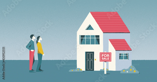 Young couple looking at house for sale