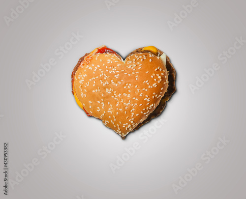 Happy Valentine\'s Day Burger concept. Restaurant Valentine\'s day concept with burger shape isolated on color background. Love burger shape white background.